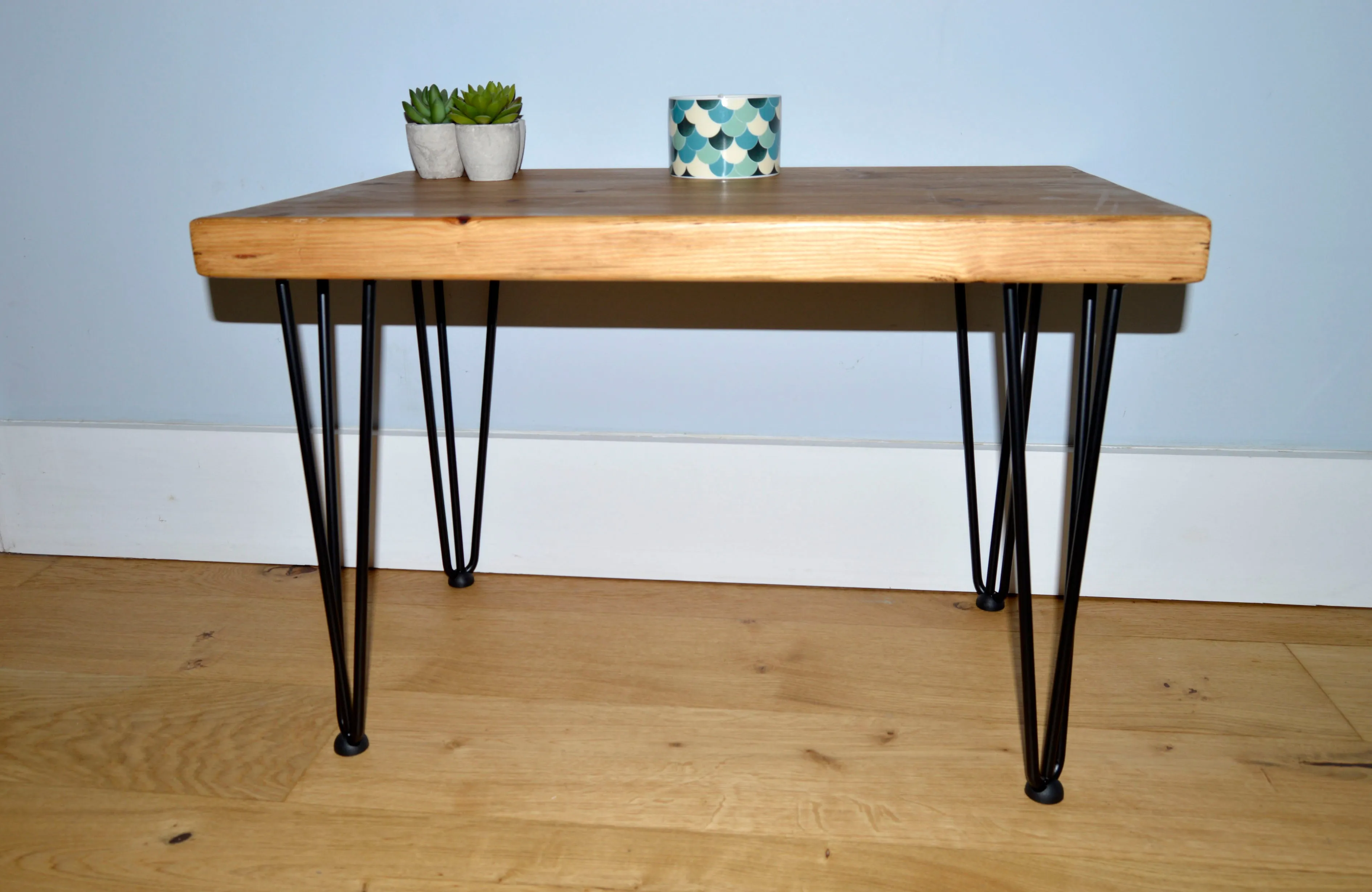 Chunky Redwood coffee table with Black hairpin steel legs